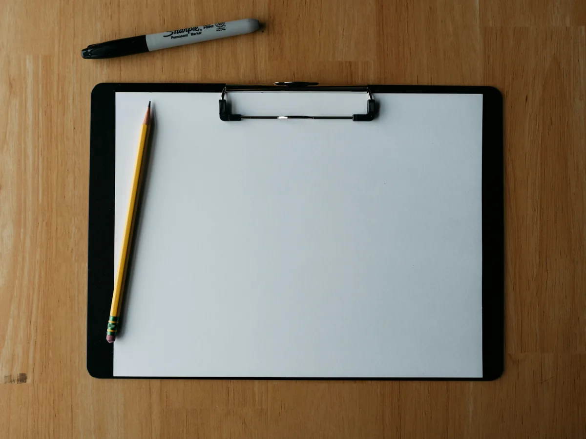 A clipboard and pencil — the quote waiting to be followed up